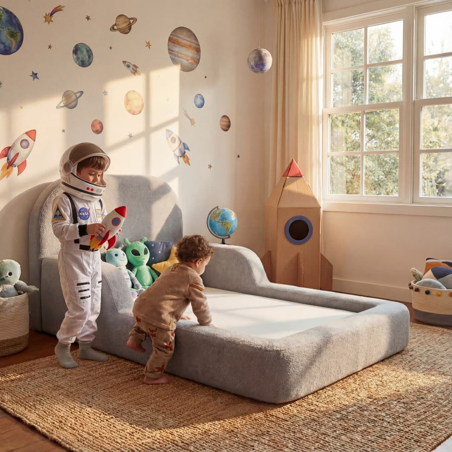 Toddlers playing beside a Stone Castle Gray Little Duck Bed